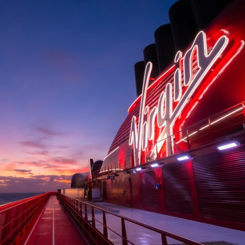 Virgin sign illuminated with a view of a gorgeous sunset over The Runway. (credit: @ginajoyphoto)